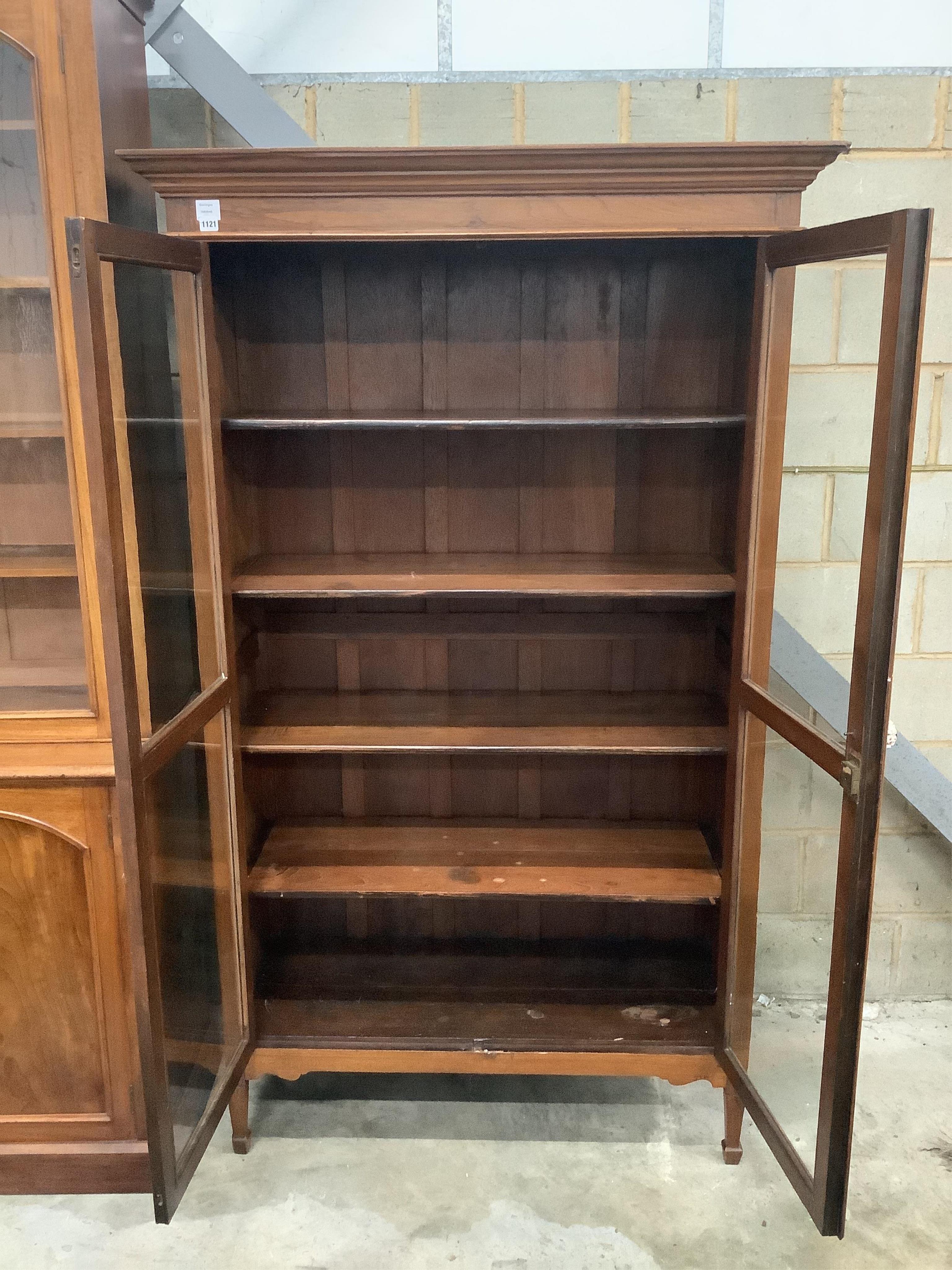 A late 19th century Indian teak glazed cabinet, width 120cm, depth 48cm, height 198cm. Condition - good